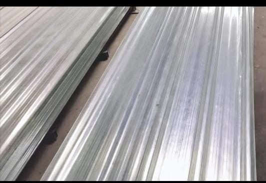 Corrugated transparent roofing sheets